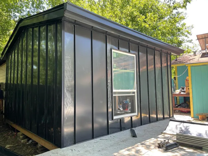 Black standing seam metal wall panels for Roof Inspection in Kalkaska