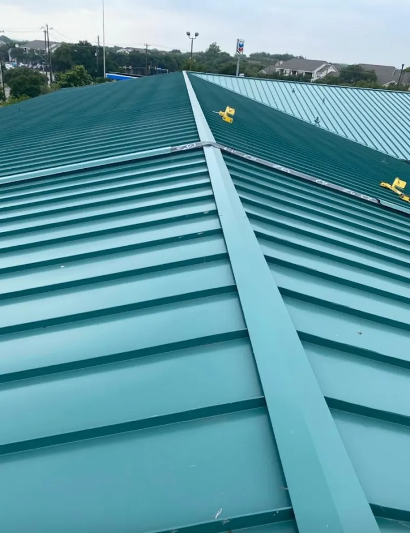 Green commercial metal roof ridge and valley for Metal Roof Repair in Kalkaska